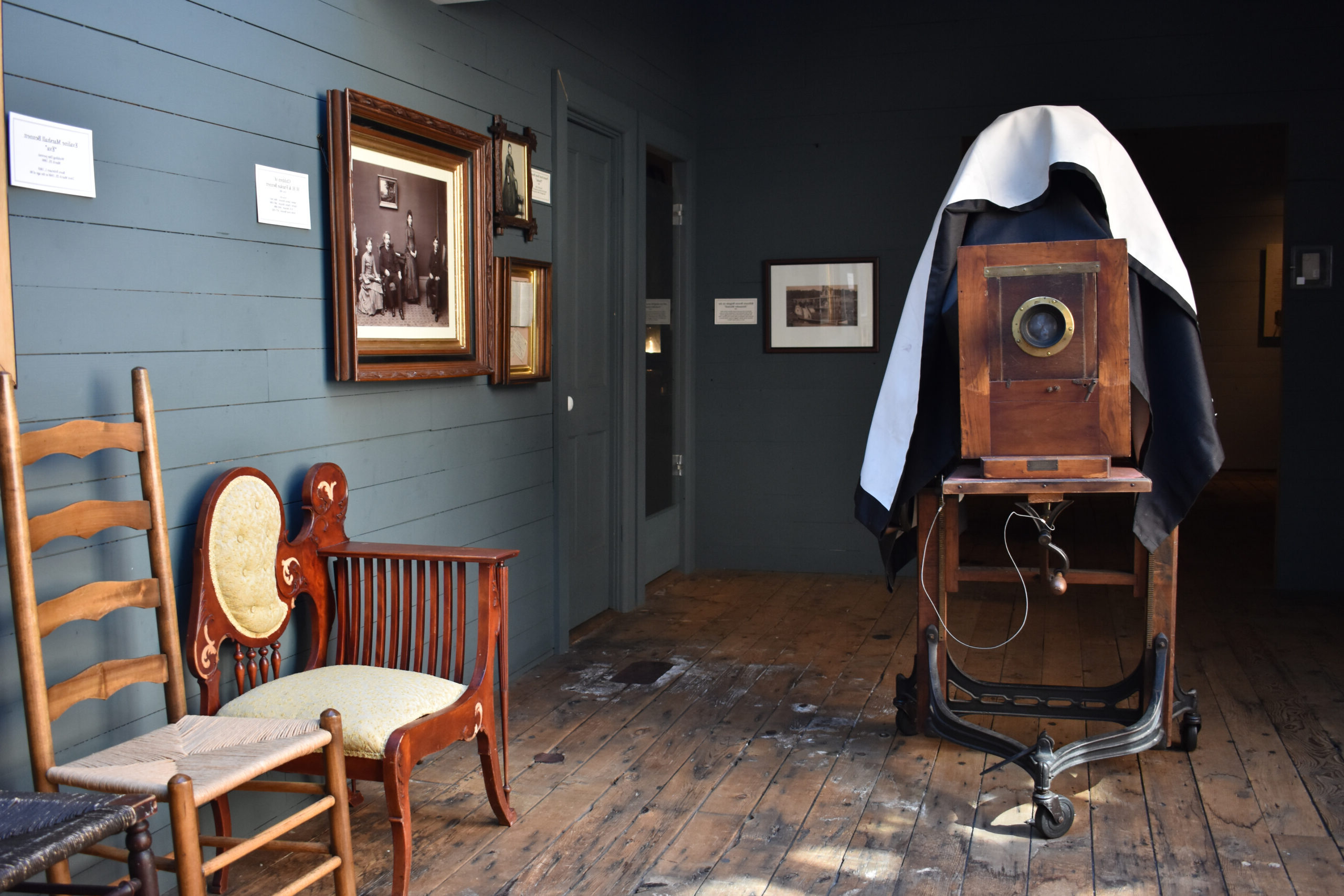 A photo of a older camera and brown wooden furniture in the HHB Studio